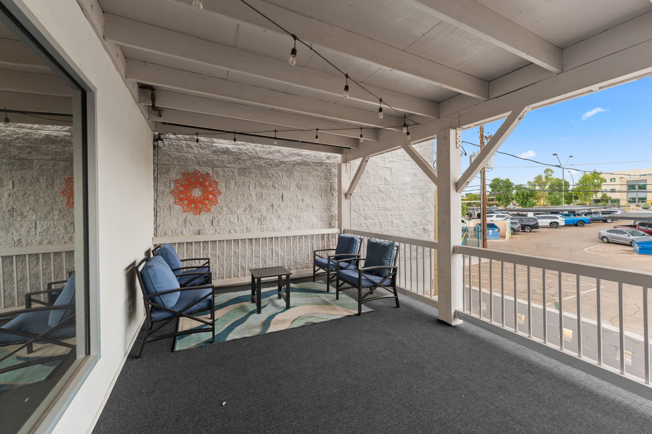 The shared covered deck at The Retreats, with outdoor seating and downtown Yuma beyond